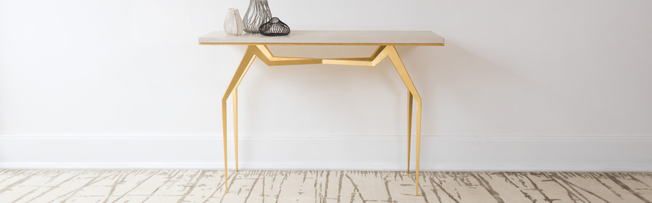 STARK designer rug with gold table.