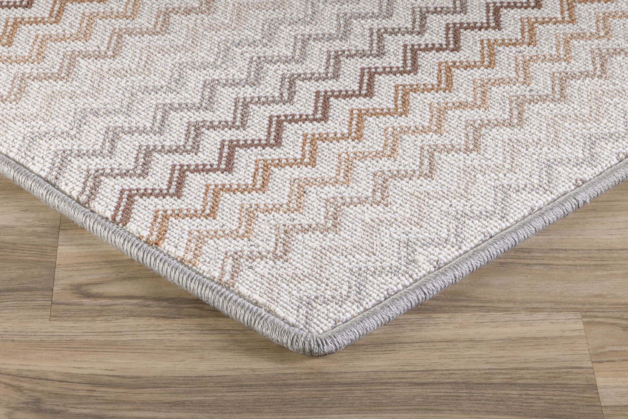 Corner of designer print with multicolored zig zap stripes.